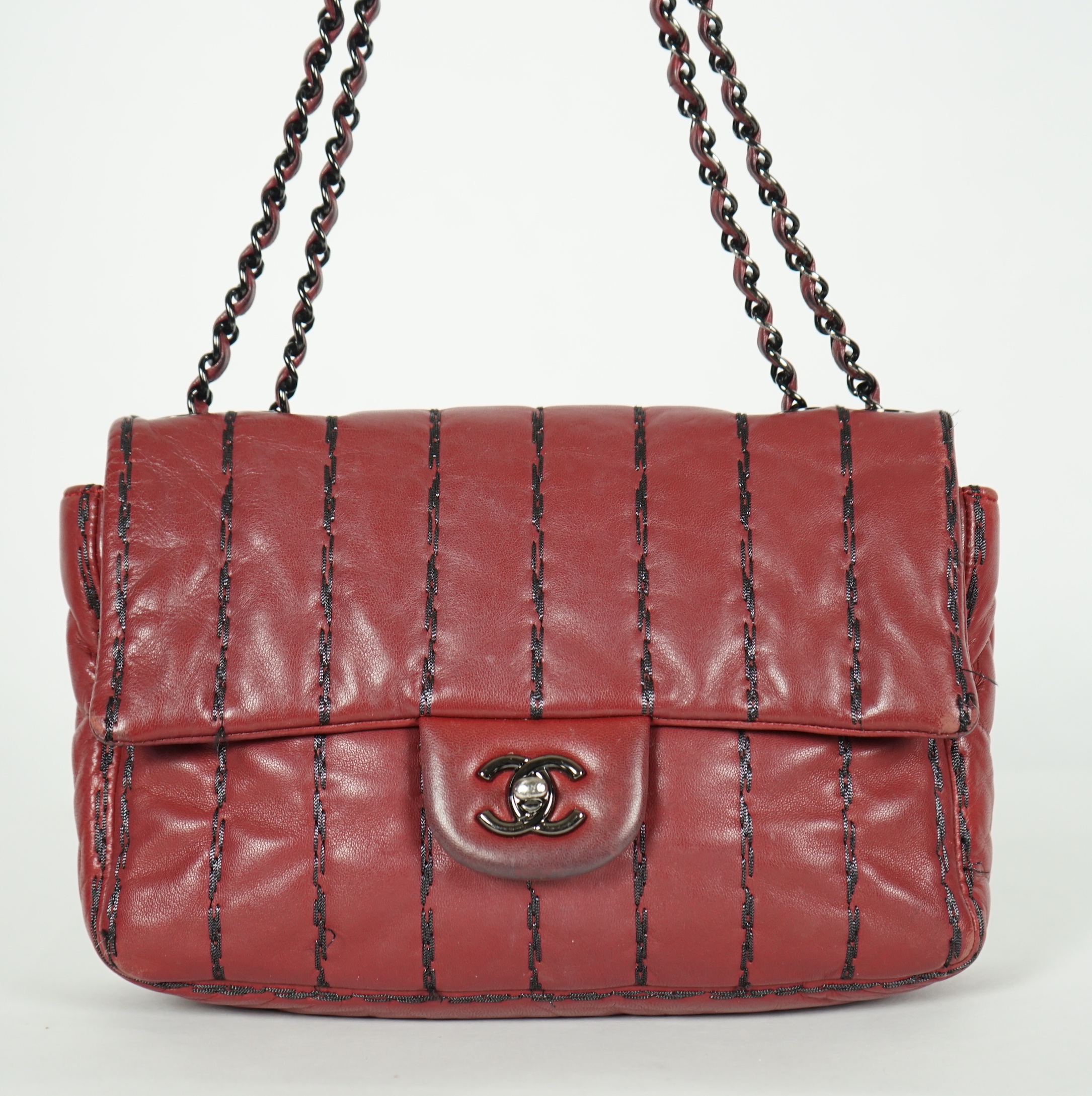 A Chanel Classic Jumbo Flap burgundy lambskin quilted shoulder bag, with pinstripe stitching, width 25cm, height 18cm, overall height 48cm, depth 6cm, Please note this lot attracts an additional import tax of 20% on the